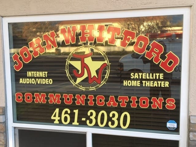 A sign for john whitford communications